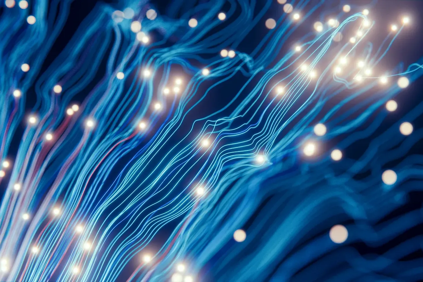 Fibre-optic light traces running through darkness